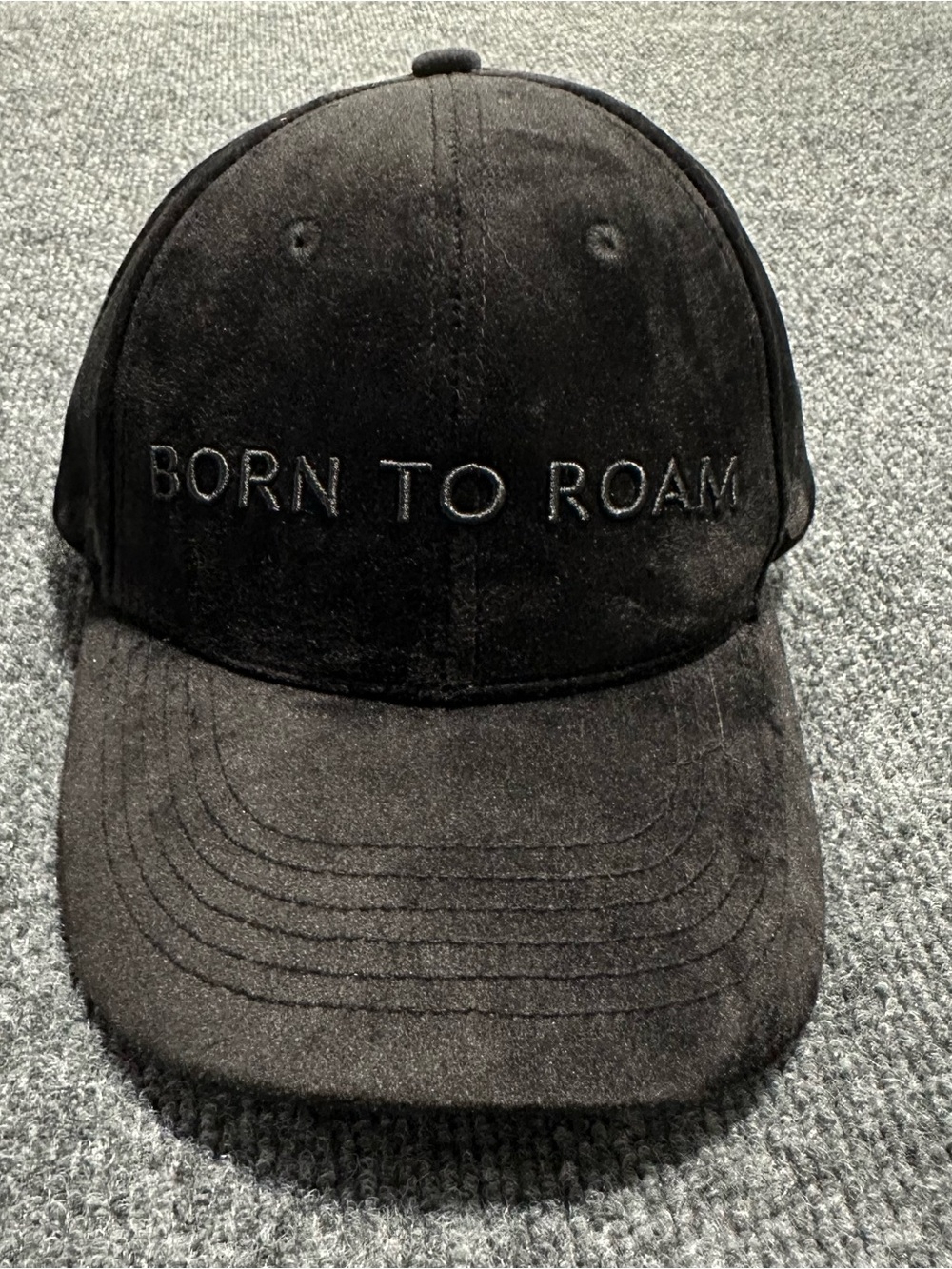 Born To Roam dark faux-suede finish with tone-on-tone embroidered logo